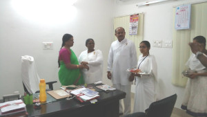 Tying Rakhi to D.R.O. Sis. Manimala, Kamareddy